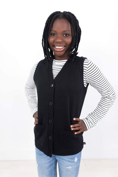 Happy girl wearing black organic cotton vest.  Designed in Canada by Author Clothing.
