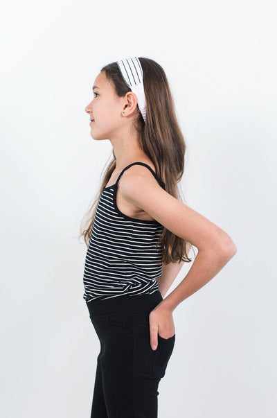 Girl wearing black organic cotton cami with white stripes.  Designed in Canada by Author Clothing.