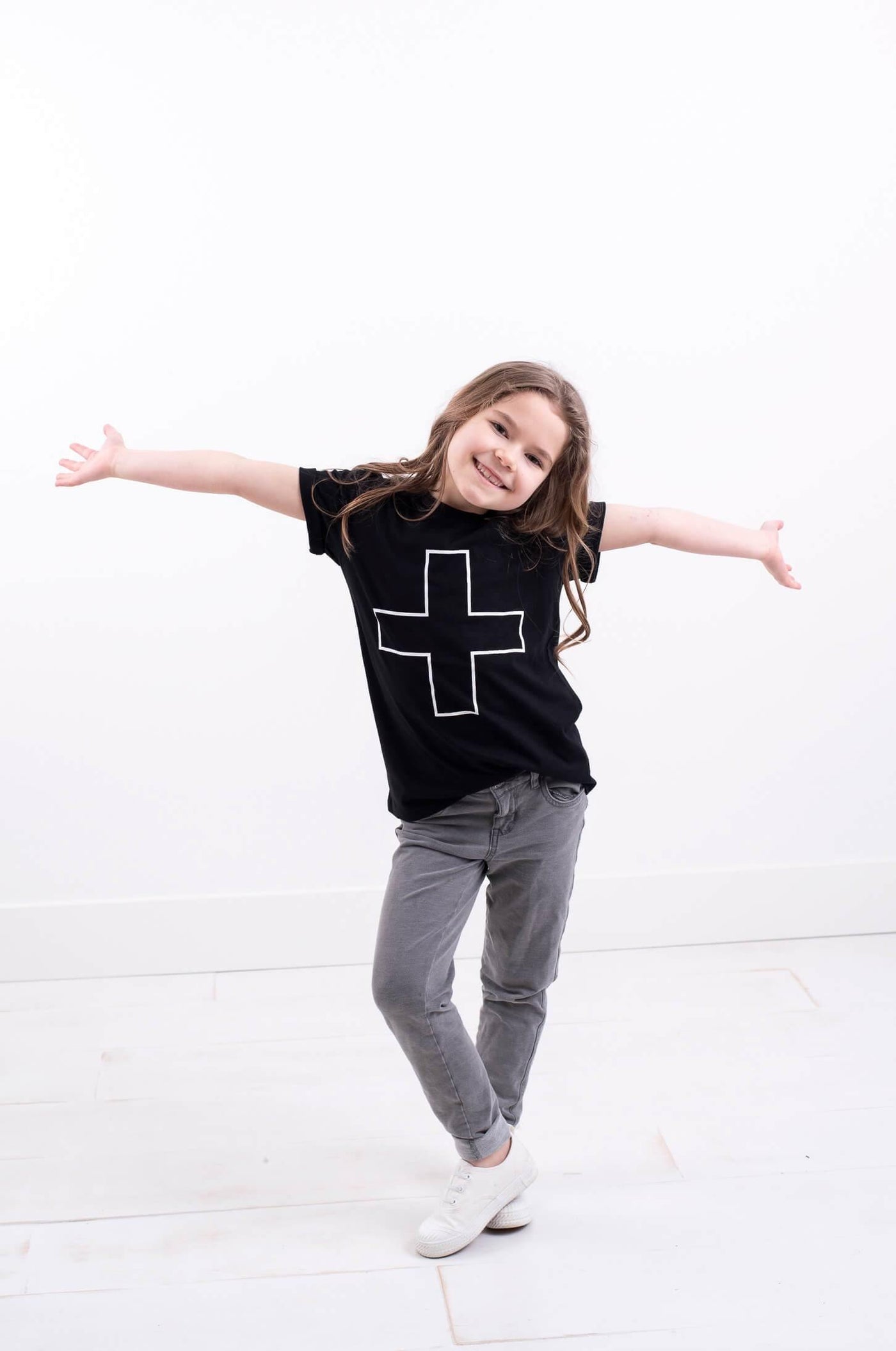 Kid's organic cotton black t-shirt with printed design.  Ethically made designed in Canada.