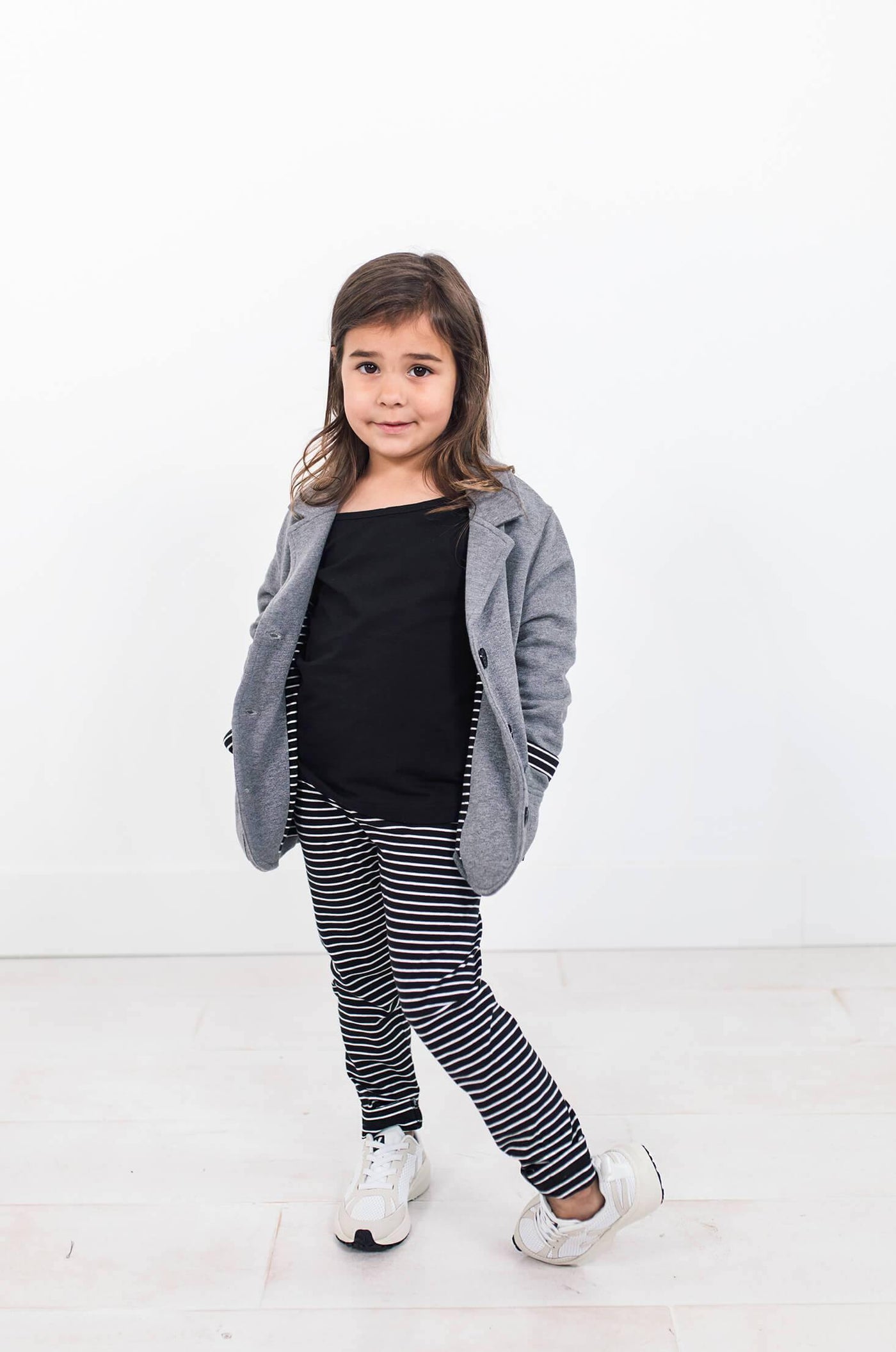 Girl wearing grey blazer made from organic cotton.  Author clothing is ethically made and designed in Canada.
