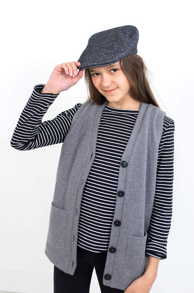 Girl wearing grey vest.  Ethically made with organic cotton.  Designed in Canada.
