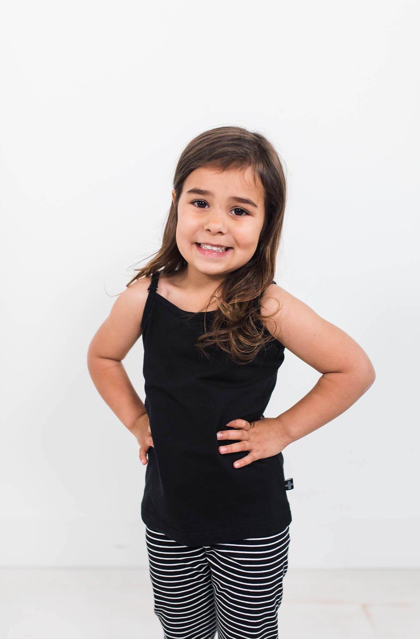 Girl wearing black organic cotton cami.  Ethically made designed in Canada.