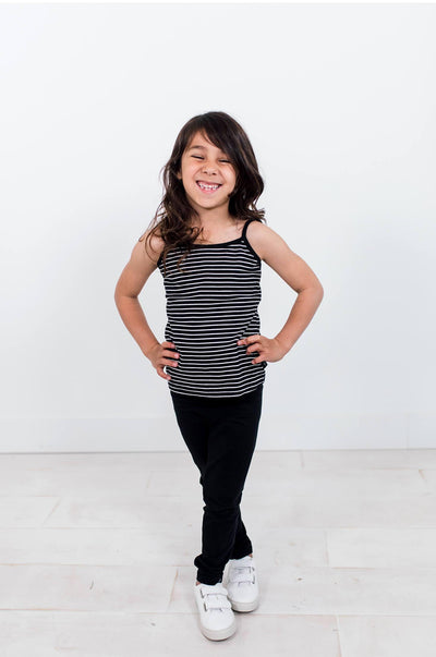 Girl wearing black organic cotton legging.  Ethically made designed in Canada.
