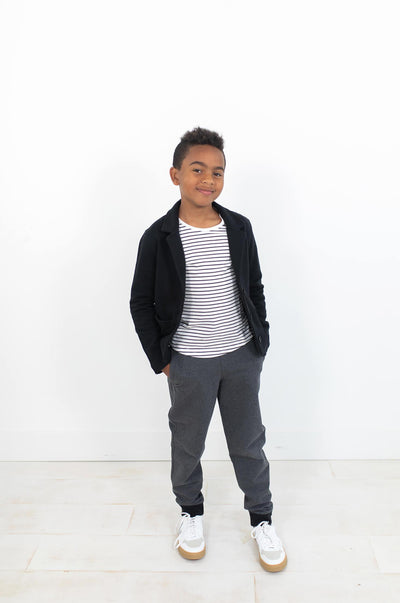 Boy wearing white with black stripes tank under black blazer.  Made from 100% organic cotton.  Perfect for capsule wardrobe collections.